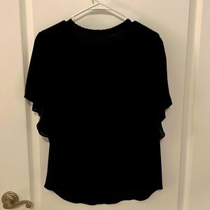 Women’s polyester black dressy top. Size large.